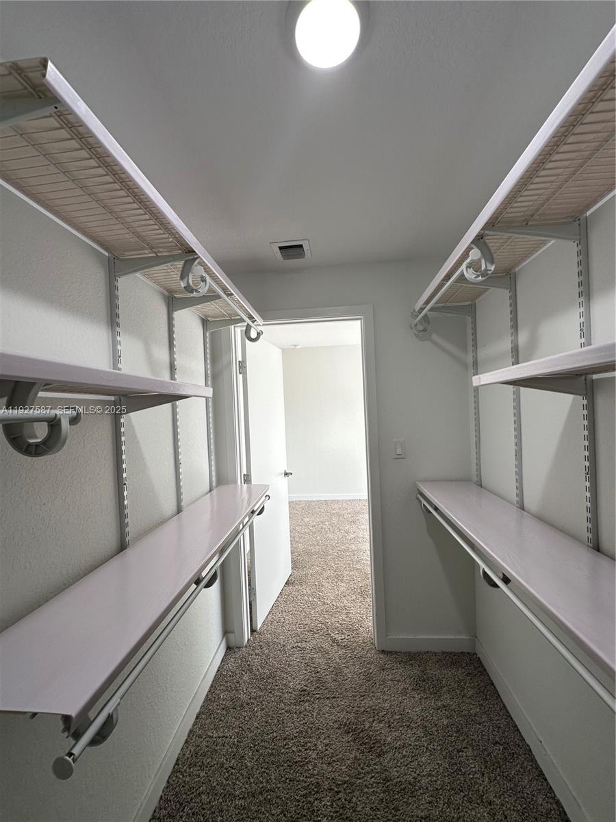 14573 Southwest 261st Terrace, Unit 14573 Homestead, FL 33032 - Photo 20 of 35 a view of a hallway with staircase