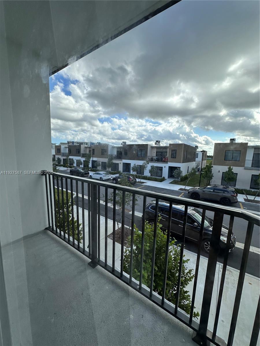 14573 Southwest 261st Terrace, Unit 14573 Homestead, FL 33032 - Photo 23 of 35 a view of city from a balcony