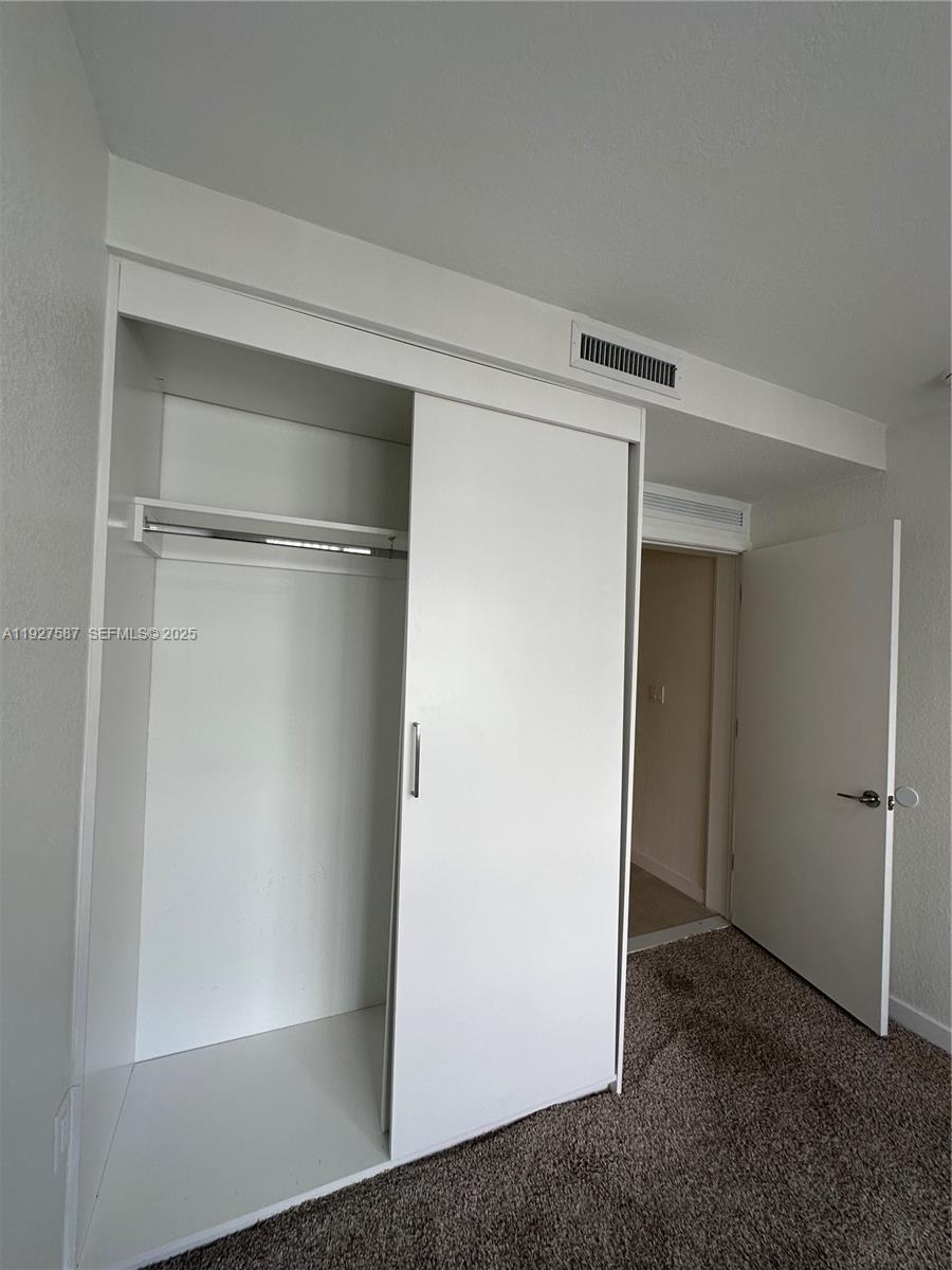 14573 Southwest 261st Terrace, Unit 14573 Homestead, FL 33032 - Photo 25 of 35 a view of closet area