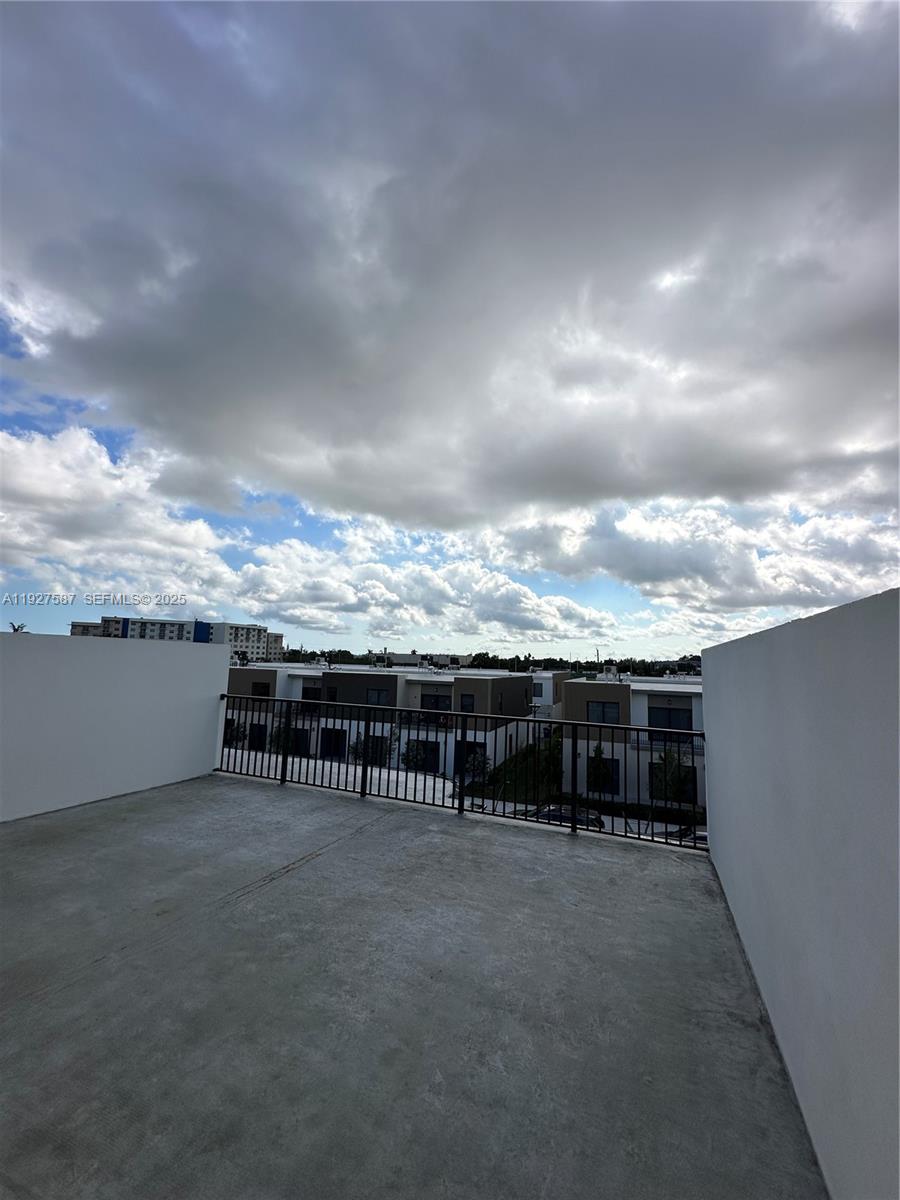 14573 Southwest 261st Terrace, Unit 14573 Homestead, FL 33032 - Photo 30 of 35 a view of a terrace with sitting area