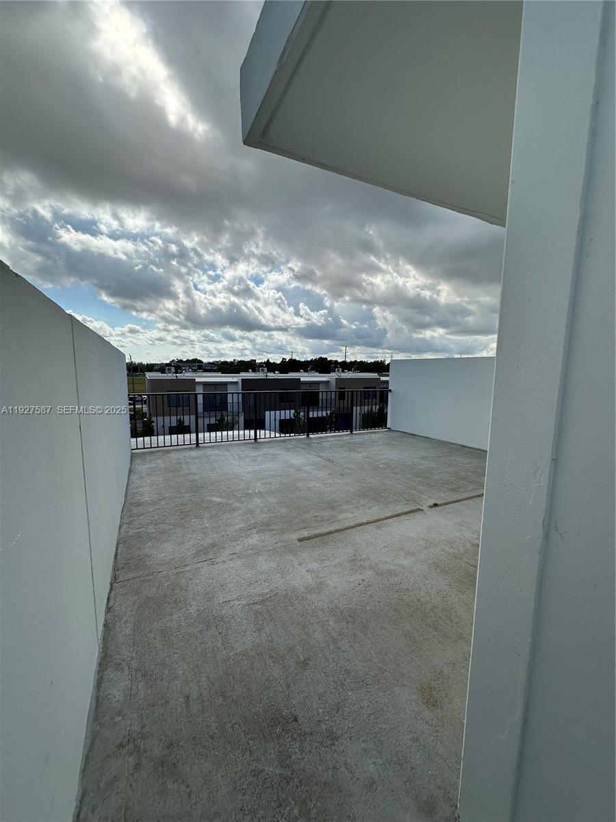 14573 Southwest 261st Terrace, Unit 14573 Homestead, FL 33032 - Photo 32 of 35 a view of building