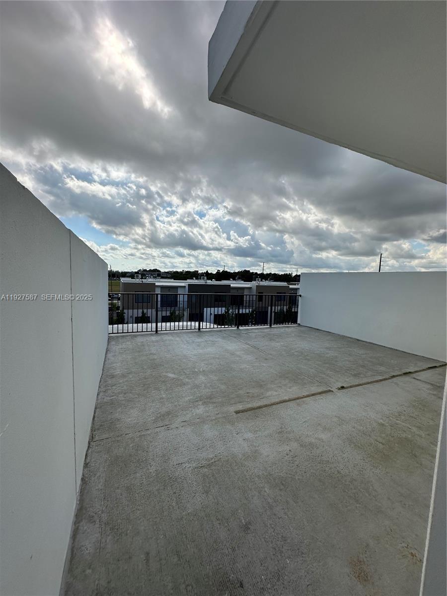 14573 Southwest 261st Terrace, Unit 14573 Homestead, FL 33032 - Photo 33 of 35 a view of a terrace with sky view