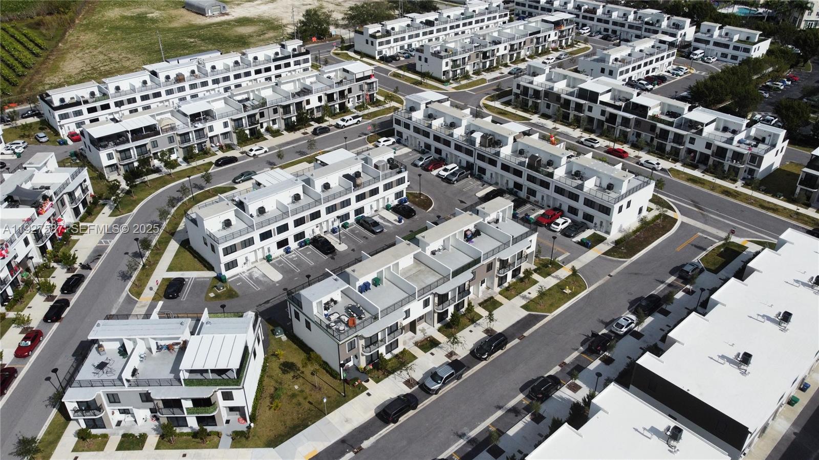 14573 Southwest 261st Terrace, Unit 14573 Homestead, FL 33032 - Photo 7 of 35 an aerial view of a city