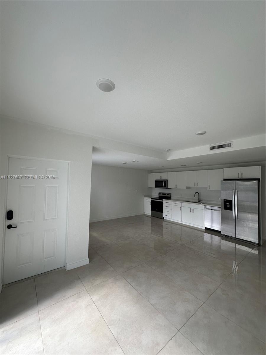 14573 Southwest 261st Terrace, Unit 14573 Homestead, FL 33032 - Photo 9 of 35 a view of a garage