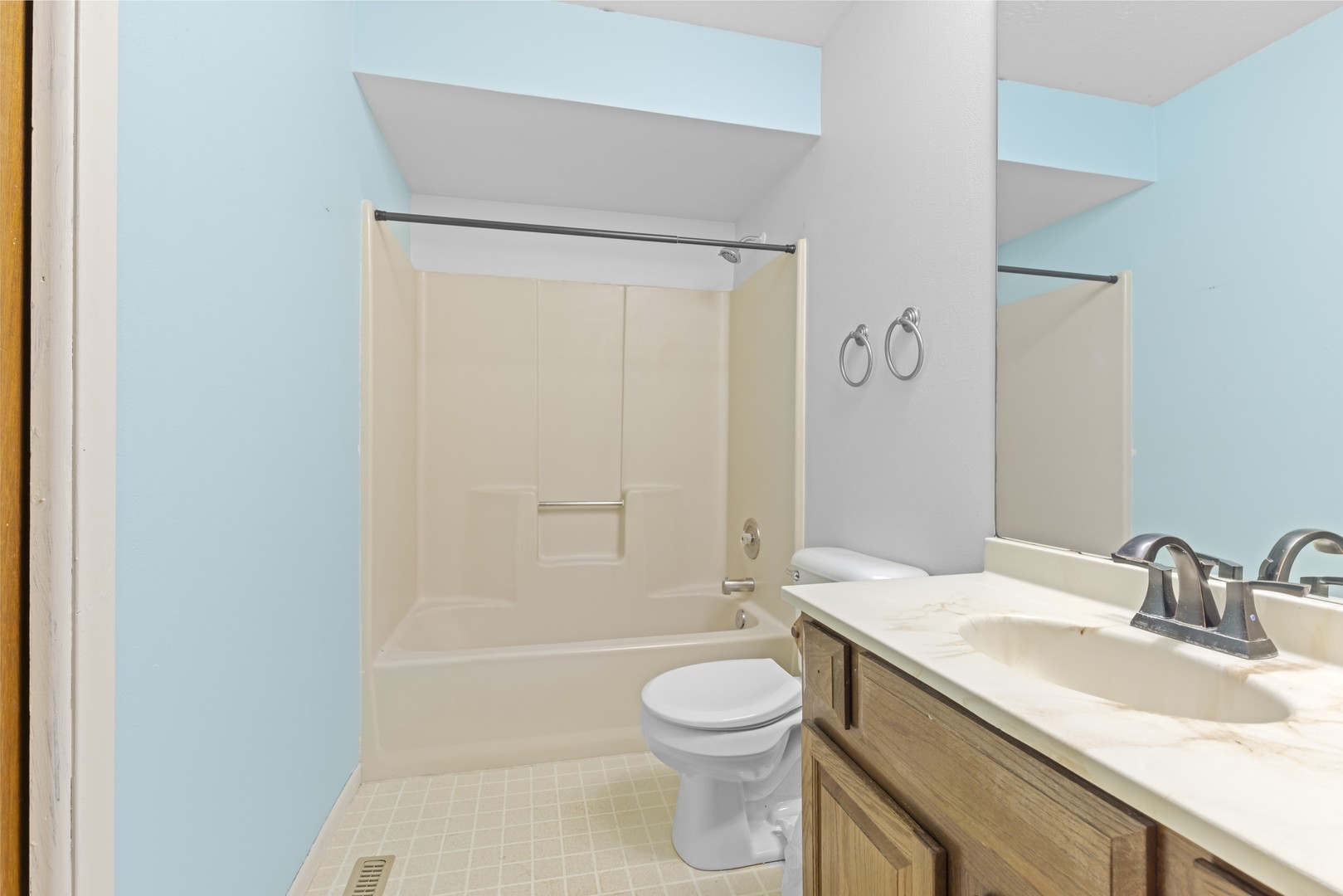 3626 Toft Street Rockford, IL 61114 - Photo 13 of 22 a bathroom with a granite countertop sink toilet a mirror and shower