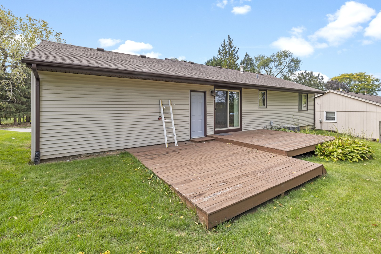 3626 Toft Street Rockford, IL 61114 - Photo 18 of 22 a wooden bench sitting in front of a house