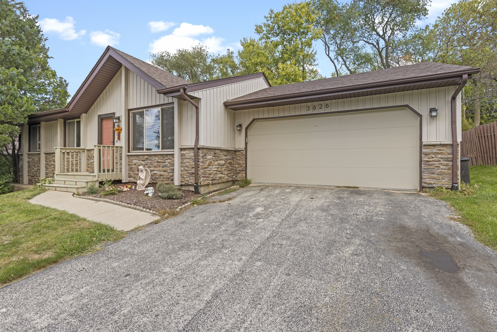 3626 Toft Street Rockford, IL 61114 - Photo 2 of 22 a view of a house with a yard and garage