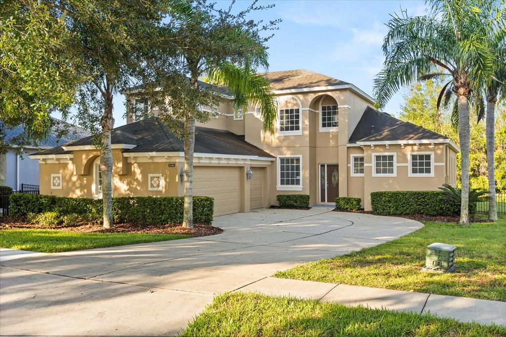 5416 Rishley Run Way Mount Dora, FL 32757 - Photo 1 of 1 a front view of a house with garden