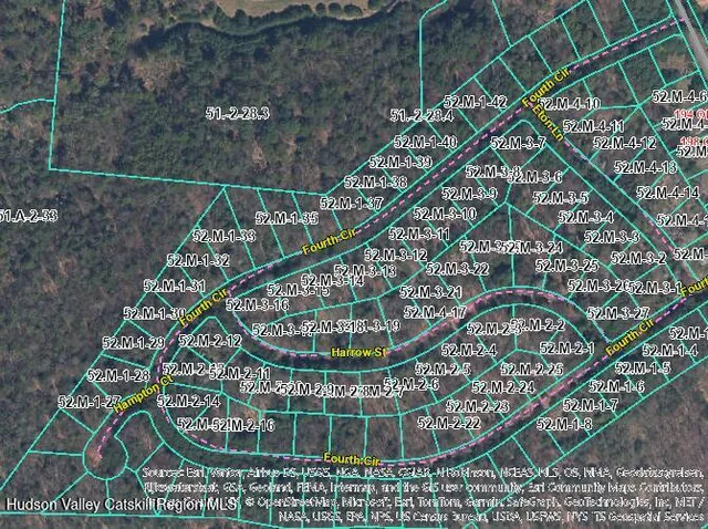 a view of staircase with railing and a chandelier