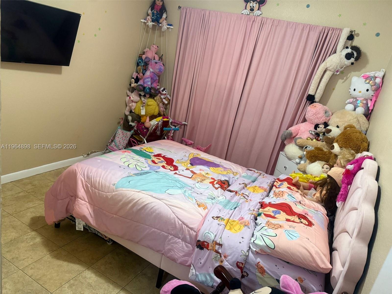 7421 Southwest 152nd Avenue, Unit 9202 Miami, FL 33193 - Photo 7 of 9 a bedroom with a bed and a dresser