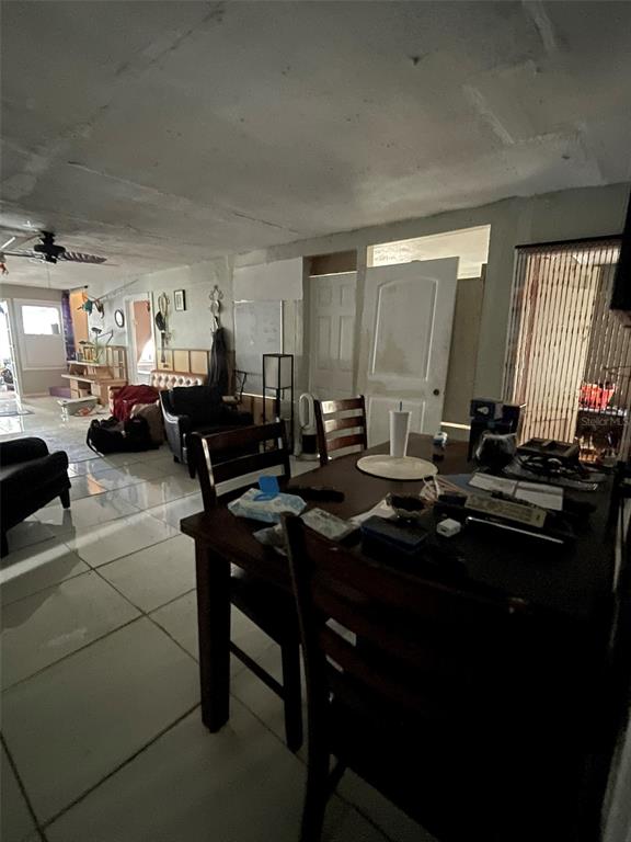 858 35th Avenue South St. Petersburg, FL 33705 - Photo 12 of 20 a living room with furniture a window and a table