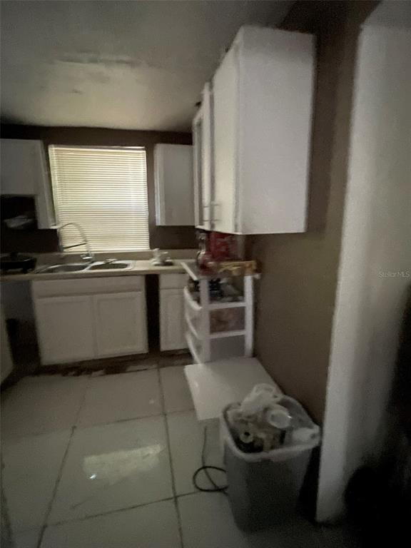 858 35th Avenue South St. Petersburg, FL 33705 - Photo 14 of 20 a kitchen with stainless steel appliances granite countertop a sink and a stove