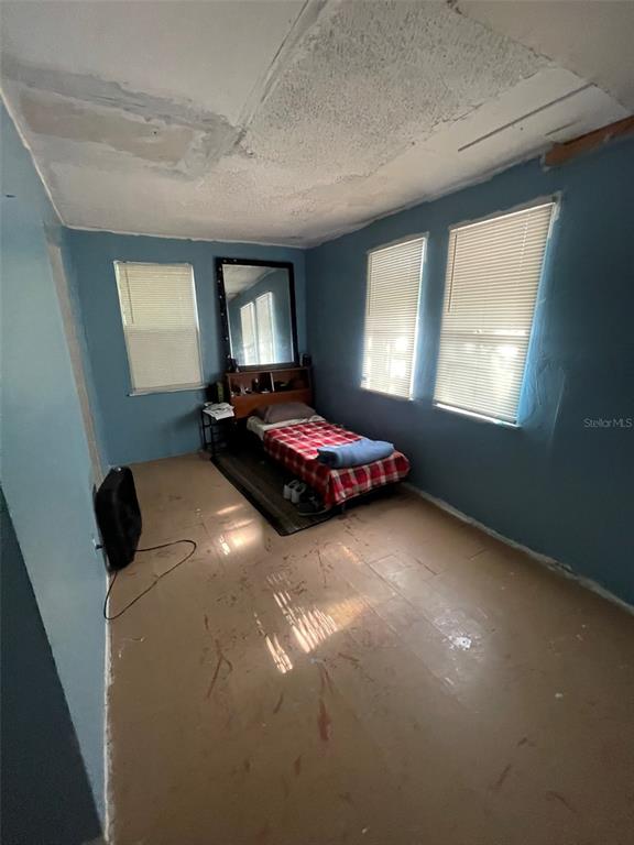 858 35th Avenue South St. Petersburg, FL 33705 - Photo 15 of 20 a bedroom with a bed and window