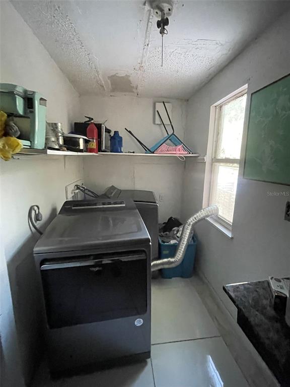 858 35th Avenue South St. Petersburg, FL 33705 - Photo 20 of 20 a kitchen with a stove and a refrigerator
