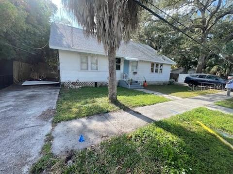 858 35th Avenue South St. Petersburg, FL 33705 - Photo 6 of 20 a front view of a house with a yard and porch
