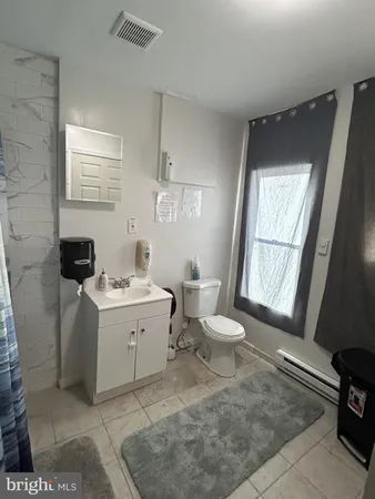 a view of a bathroom with sink and mirror