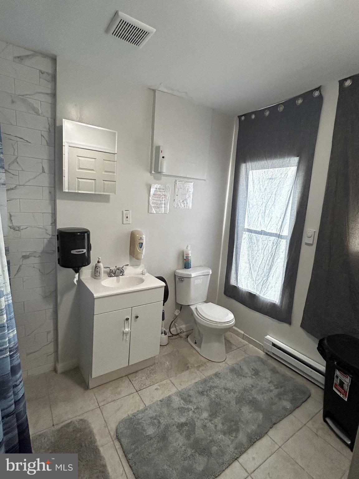 24 West 20th Street Wilmington, DE 19802 - Photo 5 of 9 a view of a bathroom with sink and mirror