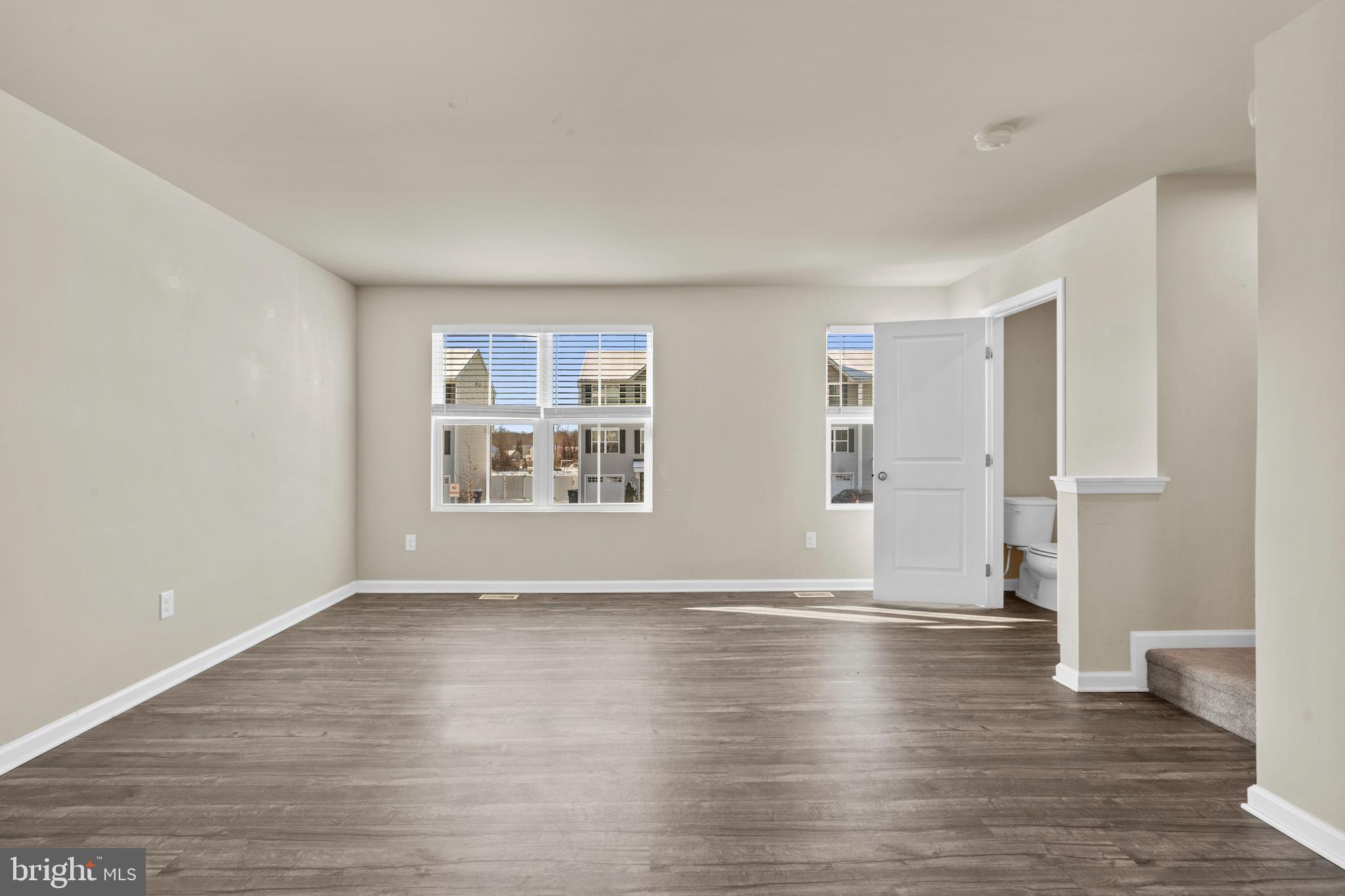 117 Comfort Road Williamstown, NJ 08094 - Photo 7 of 23 a view of an empty room with wooden floor and a window