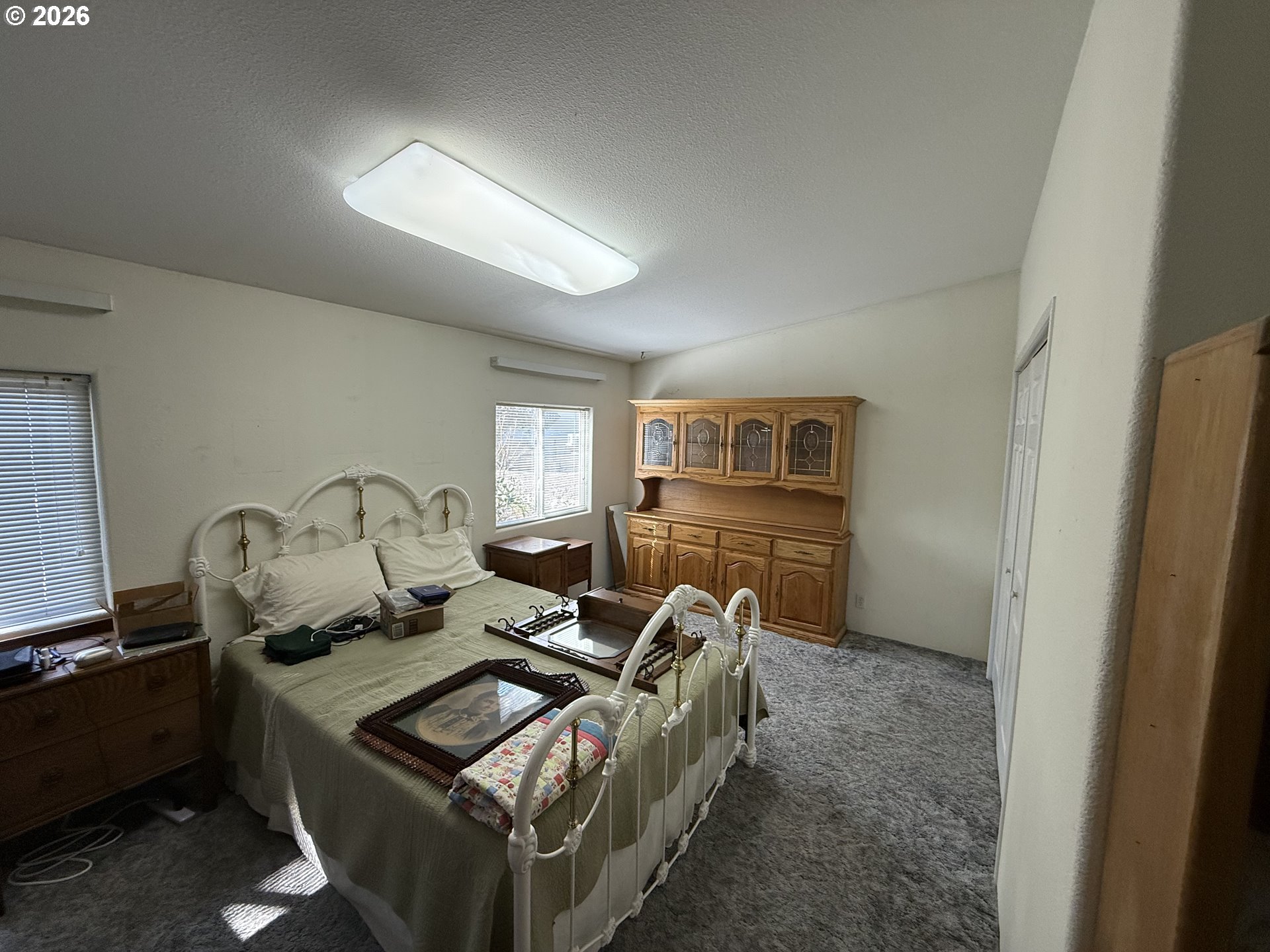 110 South Mike Road Tygh Valley, OR 97063 - Photo 25 of 42 a living room with furniture a flat screen tv and a window