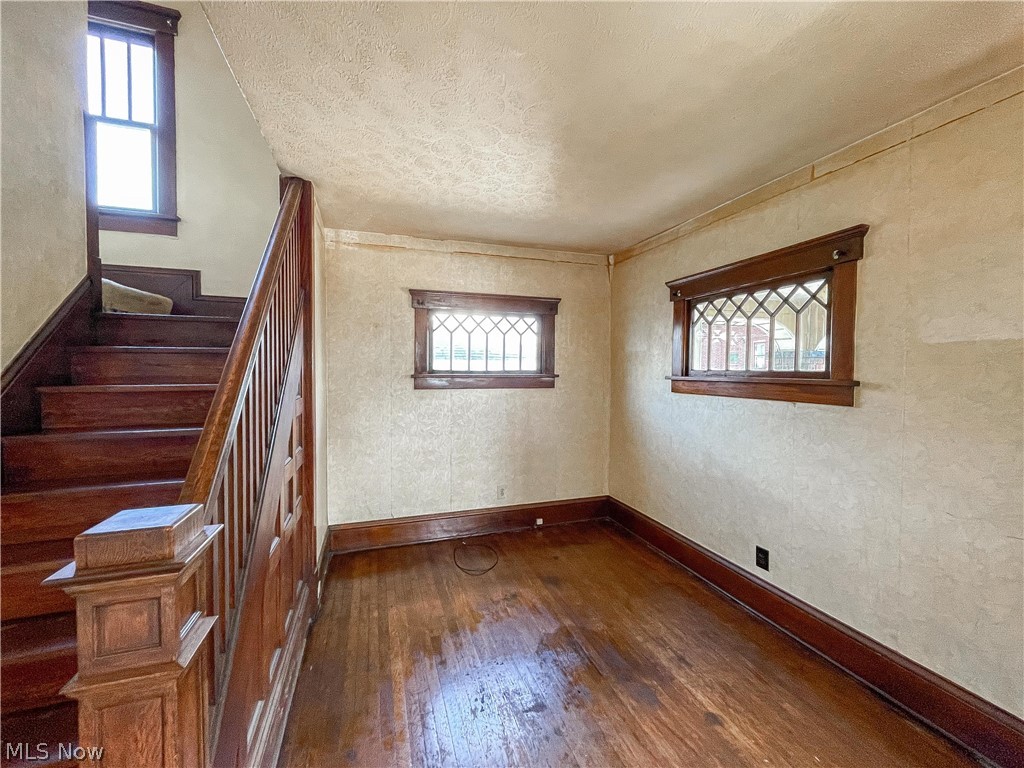 2811 9th Street Northwest Canton, OH 44708 - Photo 4 of 20 Empty room featuring a textured ceiling and dark hardwood / wood-style flooring