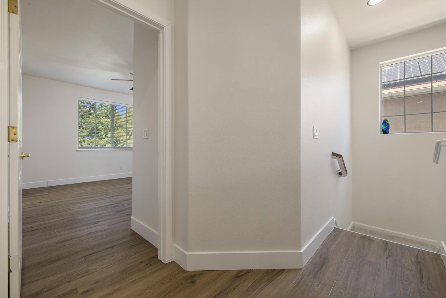 3105 Ripple Court Modesto, CA 95355 - Photo 23 of 46 a view of an empty room with wooden floor and a window
