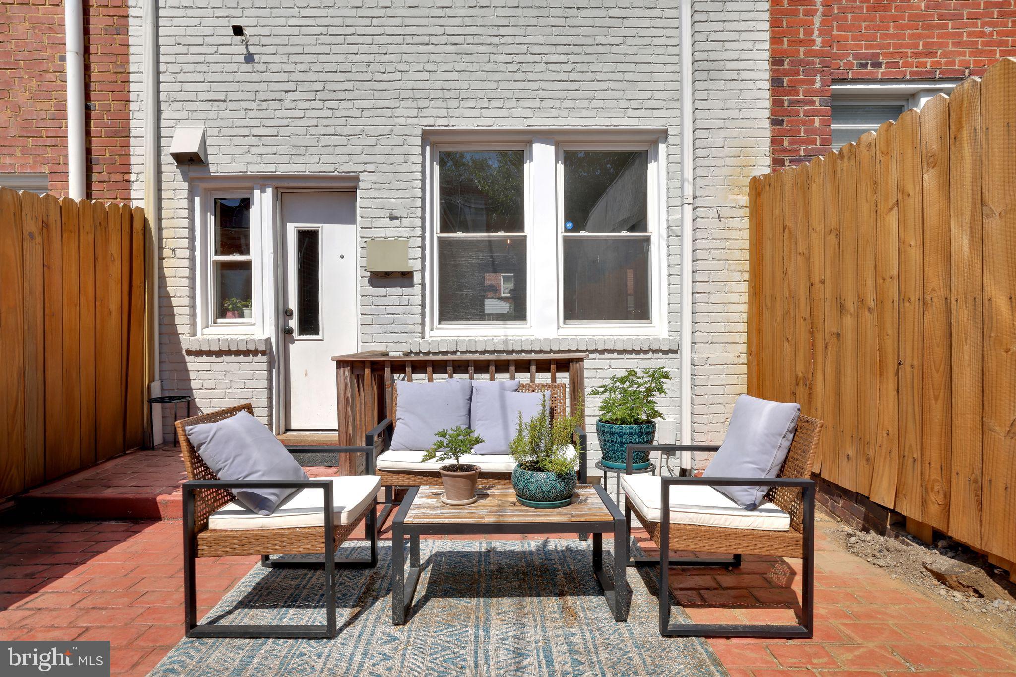 1719 Lyman Place Northeast Washington, DC 20002 - Photo 16 of 32 a view of a patio with couple of chairs and a window