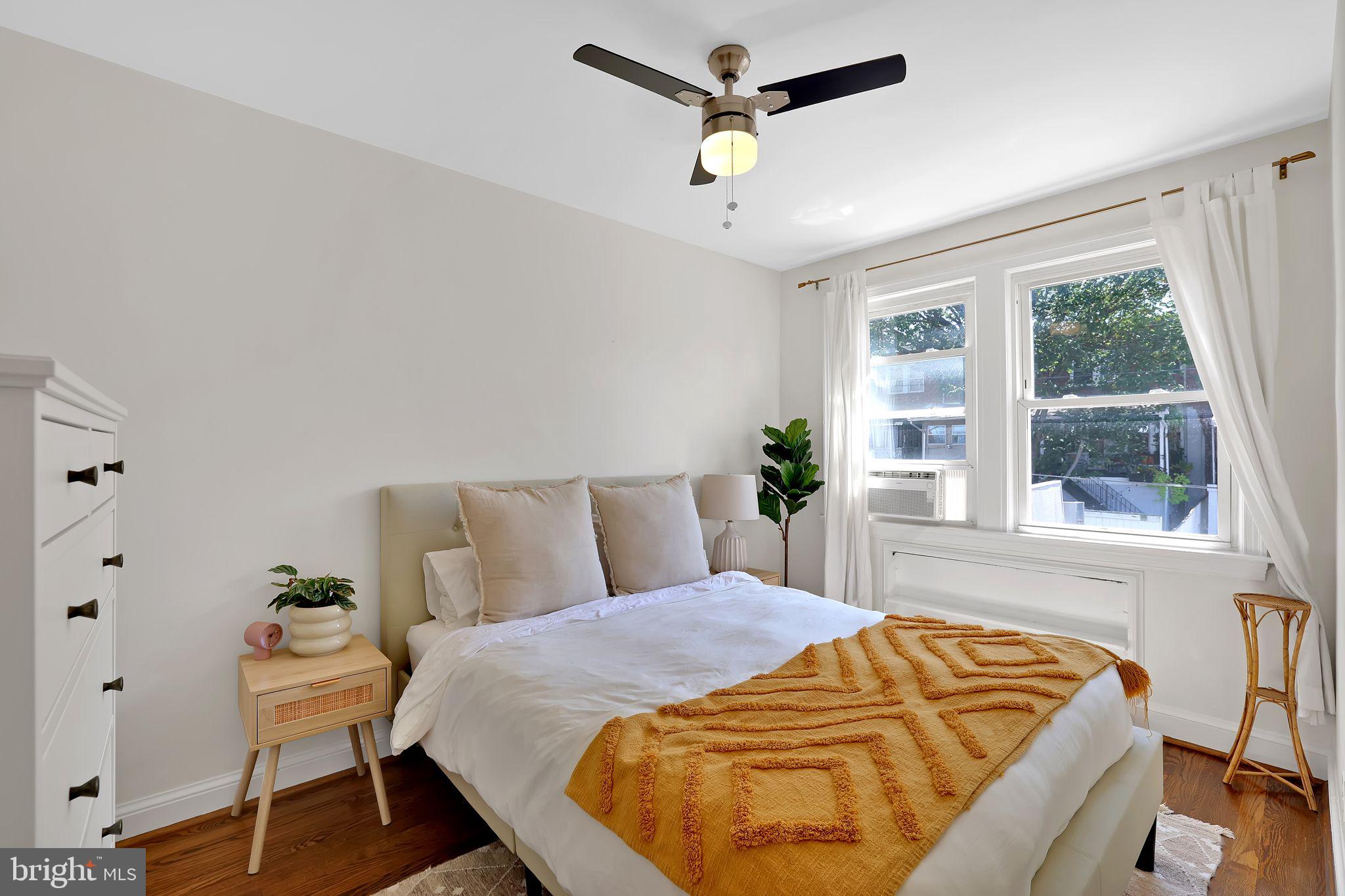 1719 Lyman Place Northeast Washington, DC 20002 - Photo 22 of 32 a bedroom with a bed and a window
