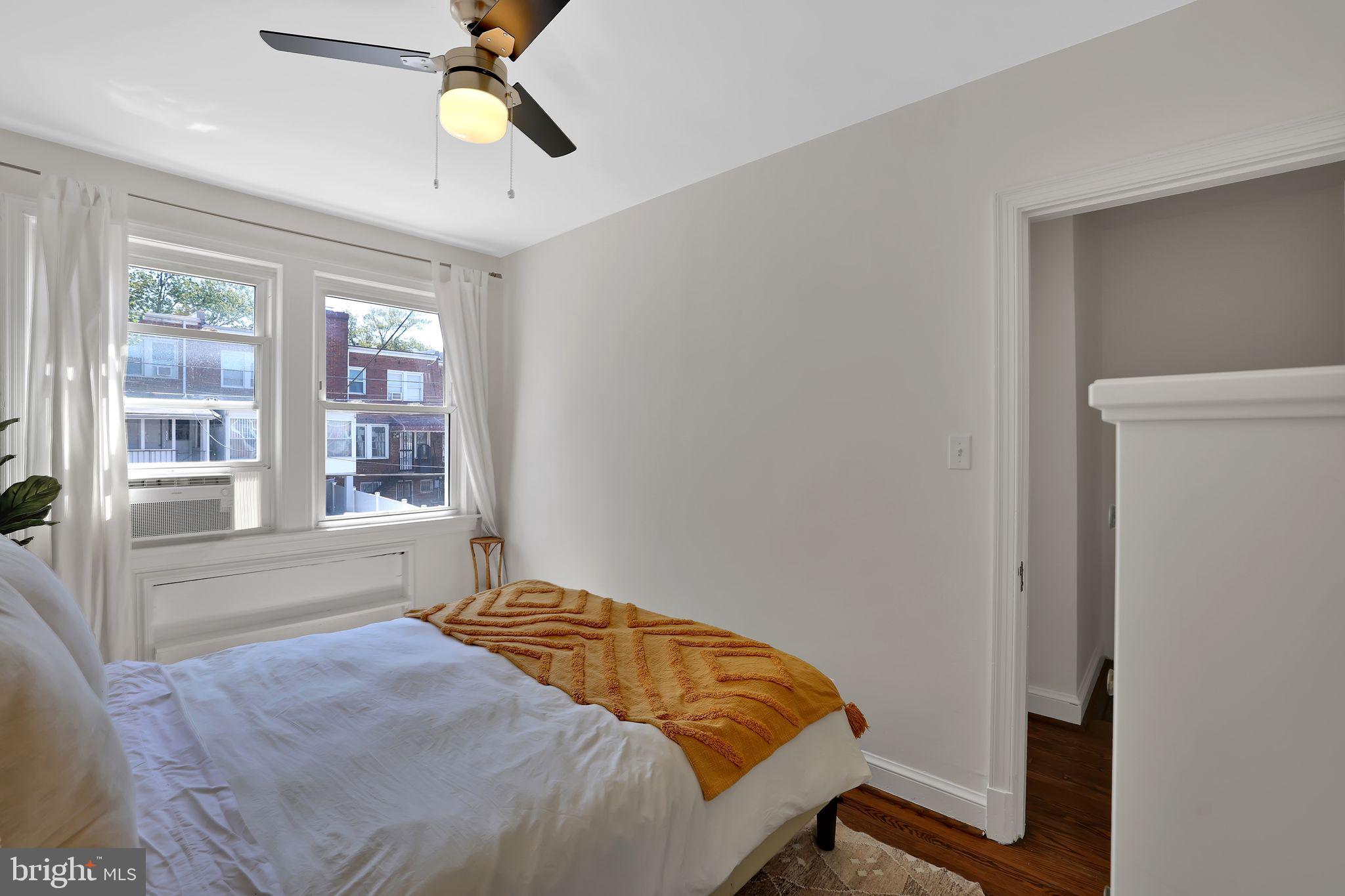 1719 Lyman Place Northeast Washington, DC 20002 - Photo 23 of 32 a bedroom with a bed and a window