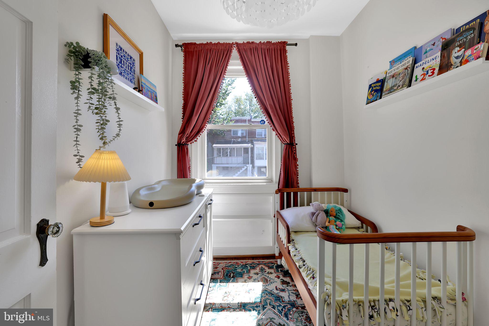 1719 Lyman Place Northeast Washington, DC 20002 - Photo 24 of 32 a bedroom with furniture and a window