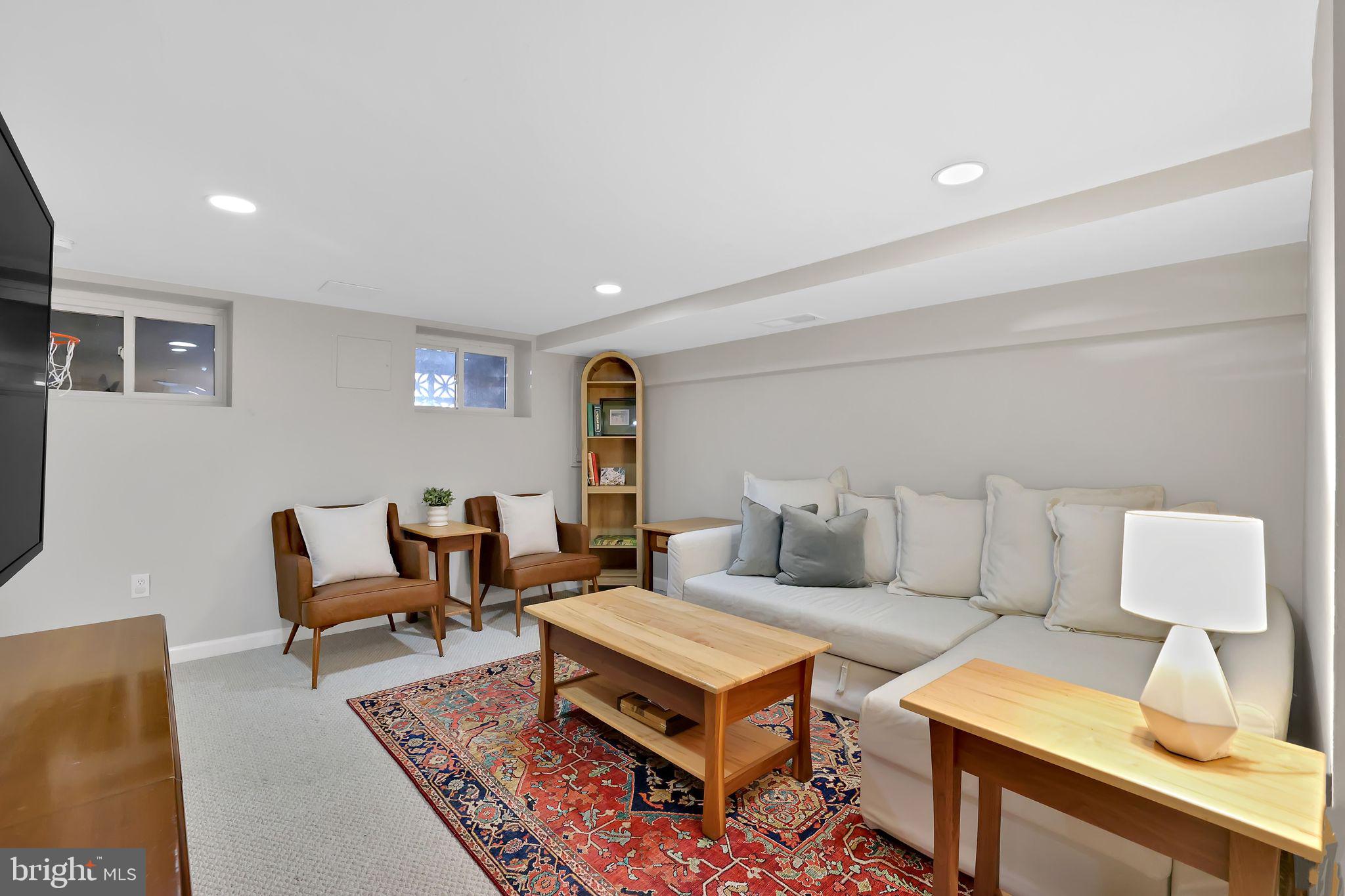 1719 Lyman Place Northeast Washington, DC 20002 - Photo 26 of 32 a living room with furniture and a lamp