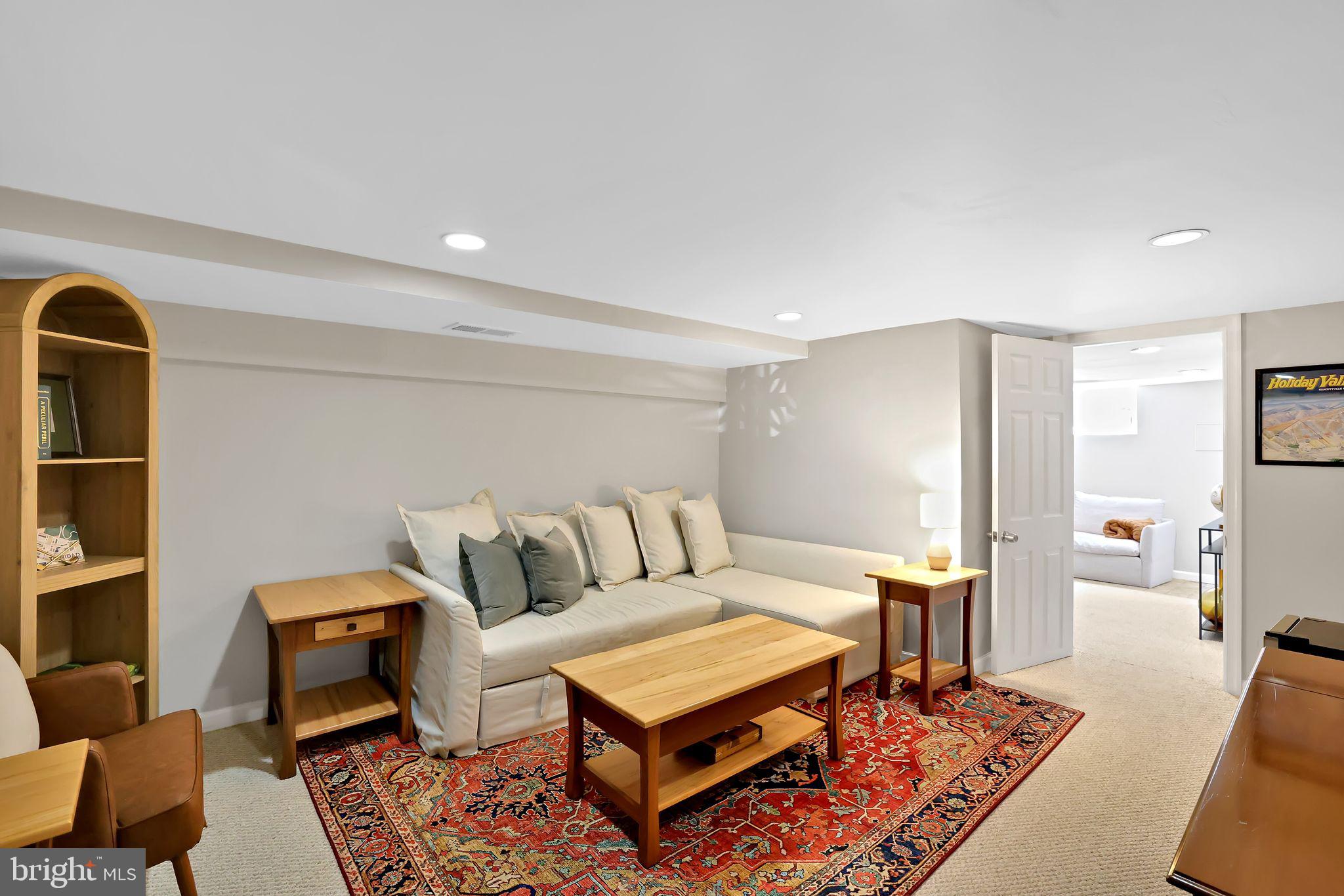 1719 Lyman Place Northeast Washington, DC 20002 - Photo 27 of 32 a living room with furniture a rug and a table