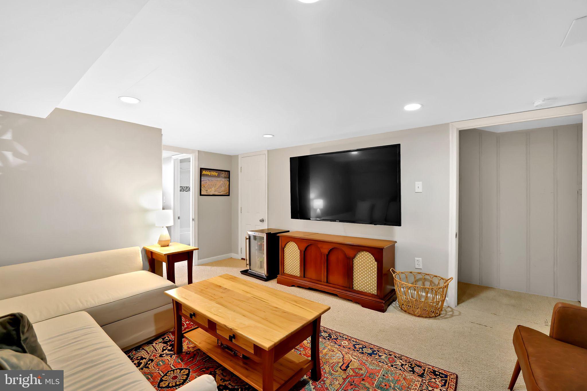 1719 Lyman Place Northeast Washington, DC 20002 - Photo 28 of 32 a living room with furniture and a flat screen tv