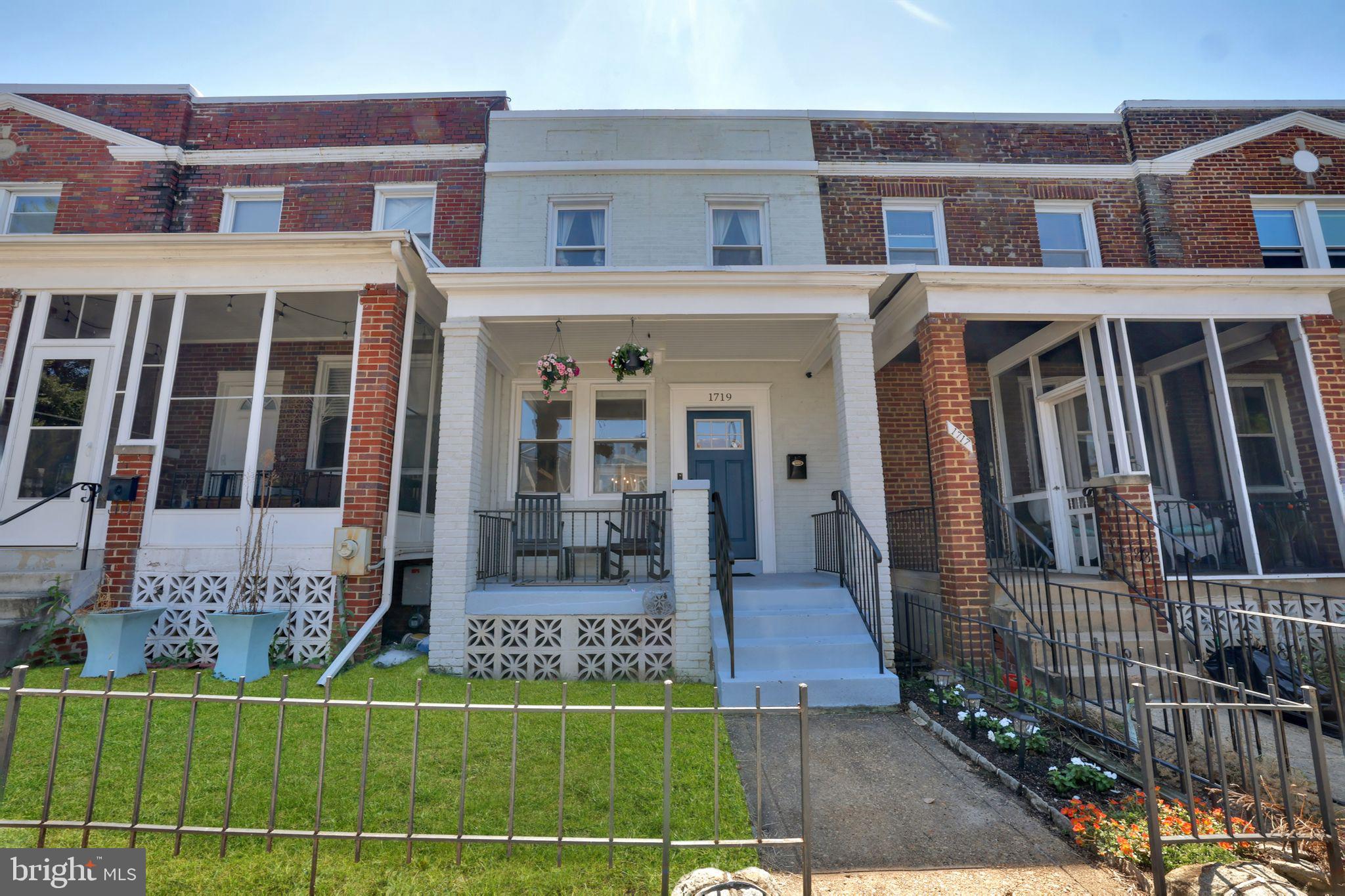 1719 Lyman Place Northeast Washington, DC 20002 - Photo 3 of 32 a front view of a house with a yard