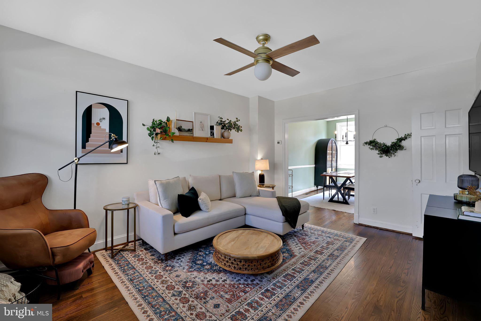 1719 Lyman Place Northeast Washington, DC 20002 - Photo 4 of 32 a living room with furniture and a rug