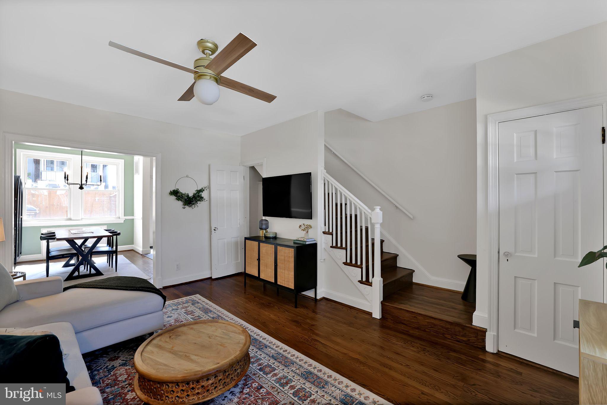 1719 Lyman Place Northeast Washington, DC 20002 - Photo 5 of 32 a living room with furniture and a flat screen tv