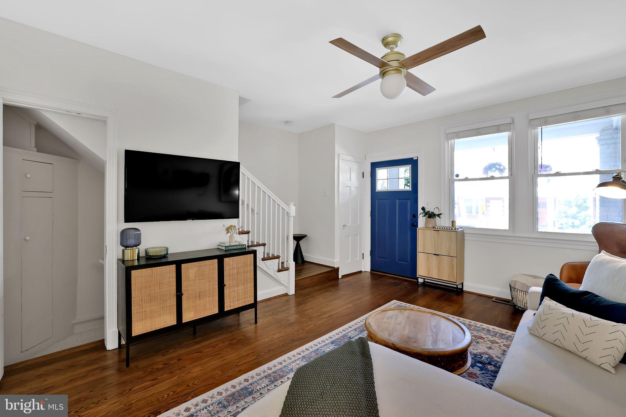 1719 Lyman Place Northeast Washington, DC 20002 - Photo 6 of 32 a living room with furniture and a flat screen tv