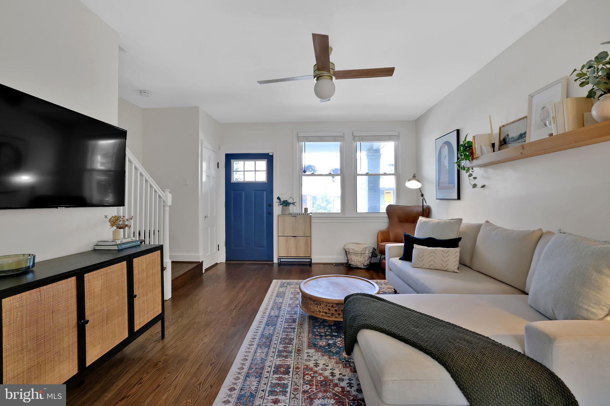 1719 Lyman Place Northeast Washington, DC 20002 - Photo 7 of 32 a living room with furniture and a flat screen tv