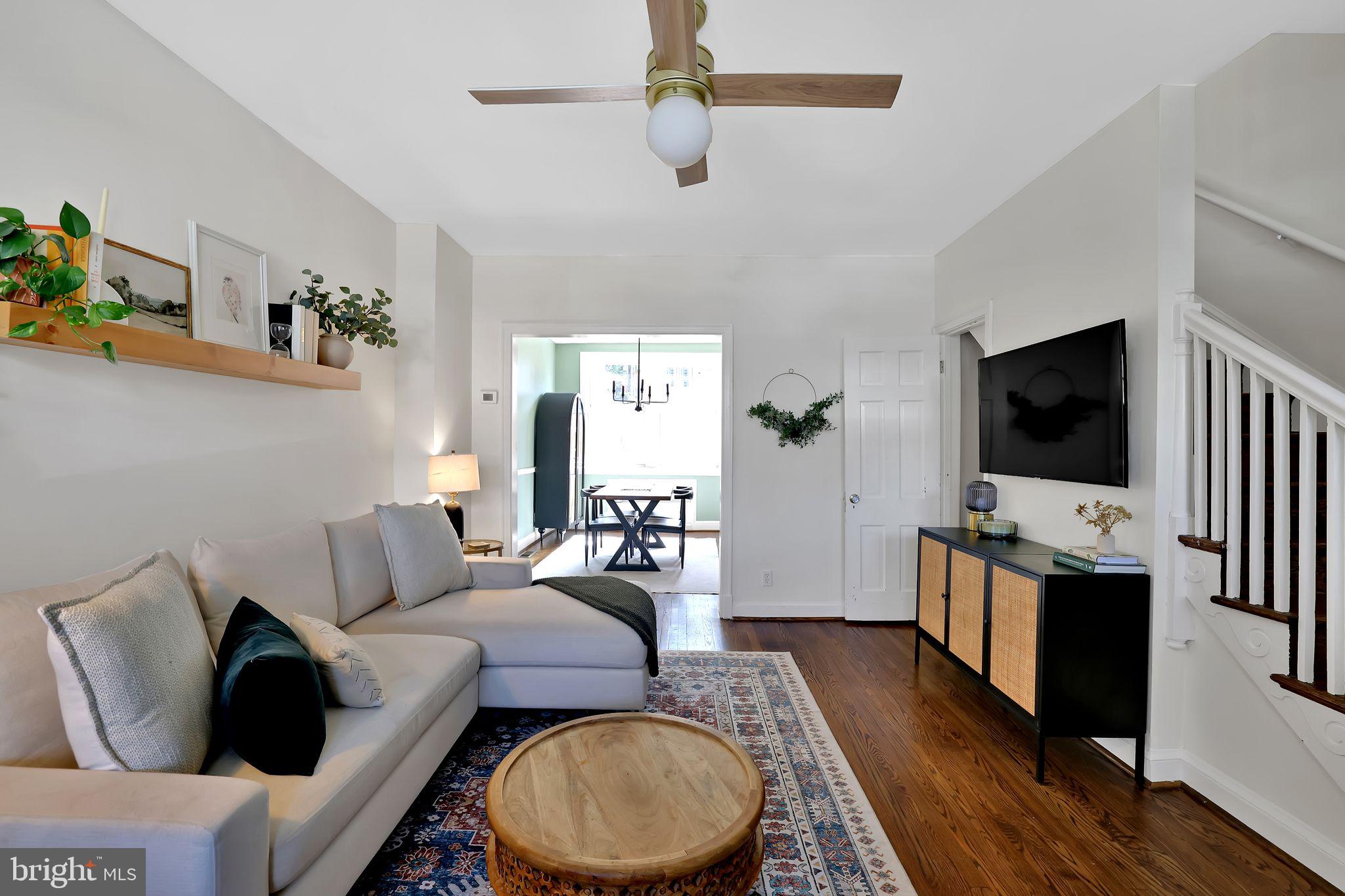 1719 Lyman Place Northeast Washington, DC 20002 - Photo 8 of 32 a living room with furniture and a flat screen tv