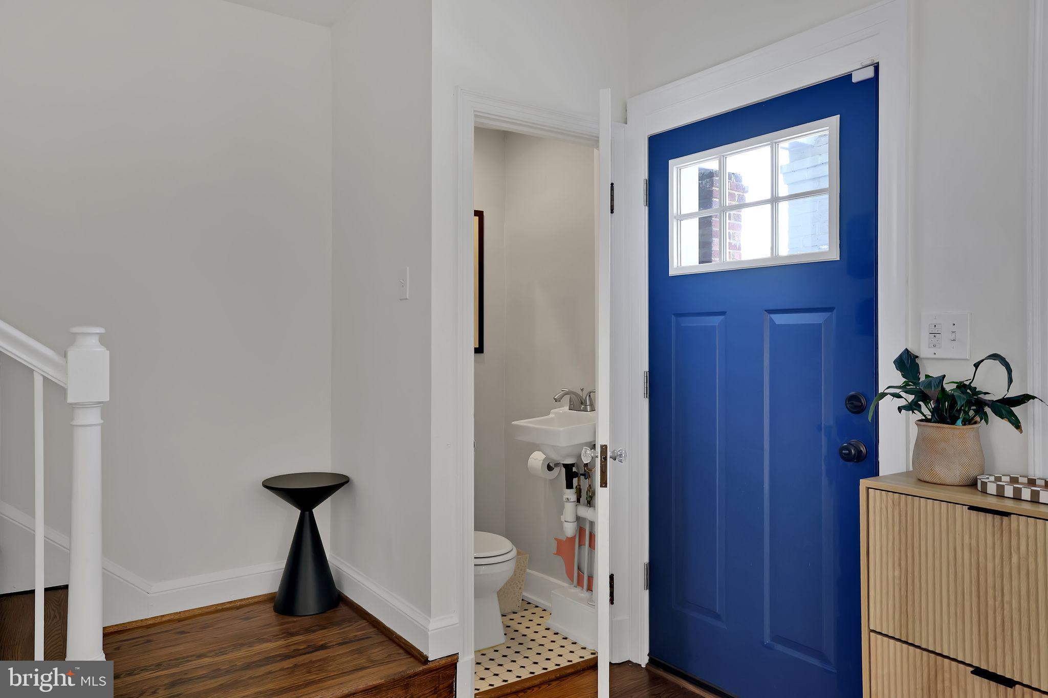 1719 Lyman Place Northeast Washington, DC 20002 - Photo 9 of 32 a room with a door open to a room