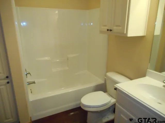a bathroom with a sink and toilet