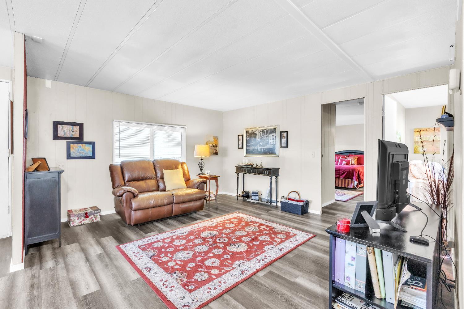 3901 Lake Road, Unit 76 West Sacramento, CA 95691 - Photo 11 of 29 a living room with furniture and a flat screen tv