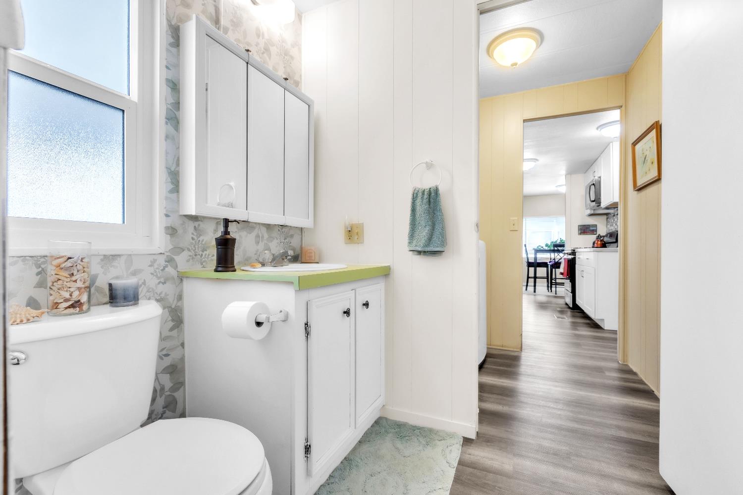 3901 Lake Road, Unit 76 West Sacramento, CA 95691 - Photo 15 of 29 a bathroom with a sink a toilet and a view of bathroom