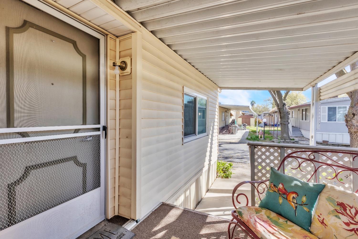 3901 Lake Road, Unit 76 West Sacramento, CA 95691 - Photo 2 of 29 a view of a balcony with chairs