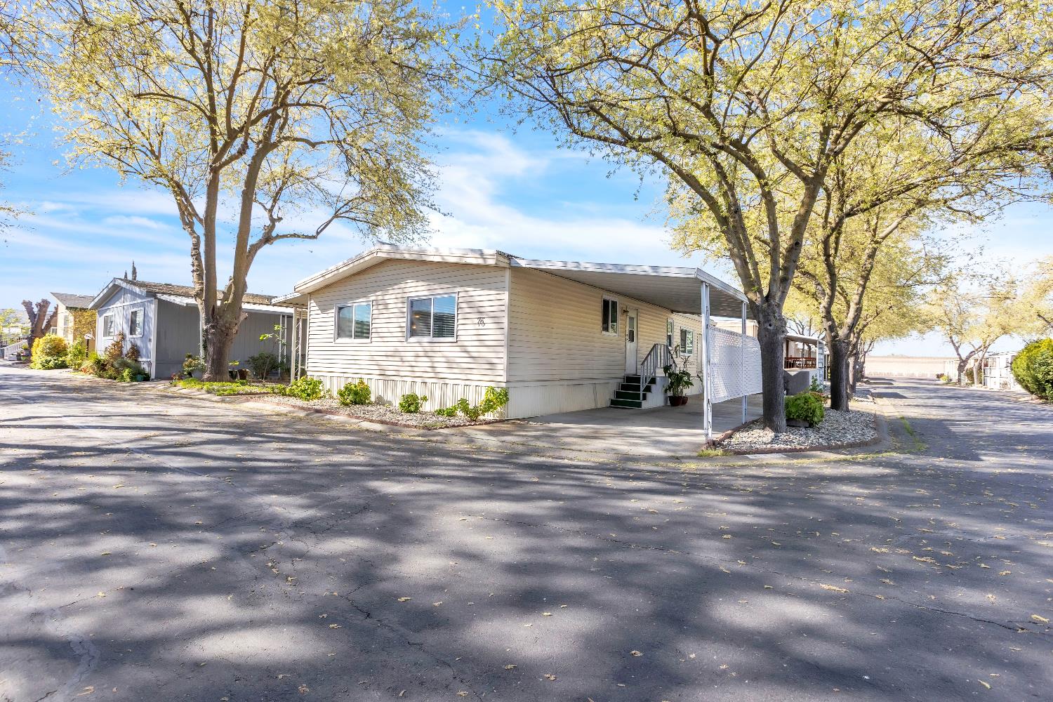 3901 Lake Road, Unit 76 West Sacramento, CA 95691 - Photo 25 of 29 a front view of a house with a yard and garage