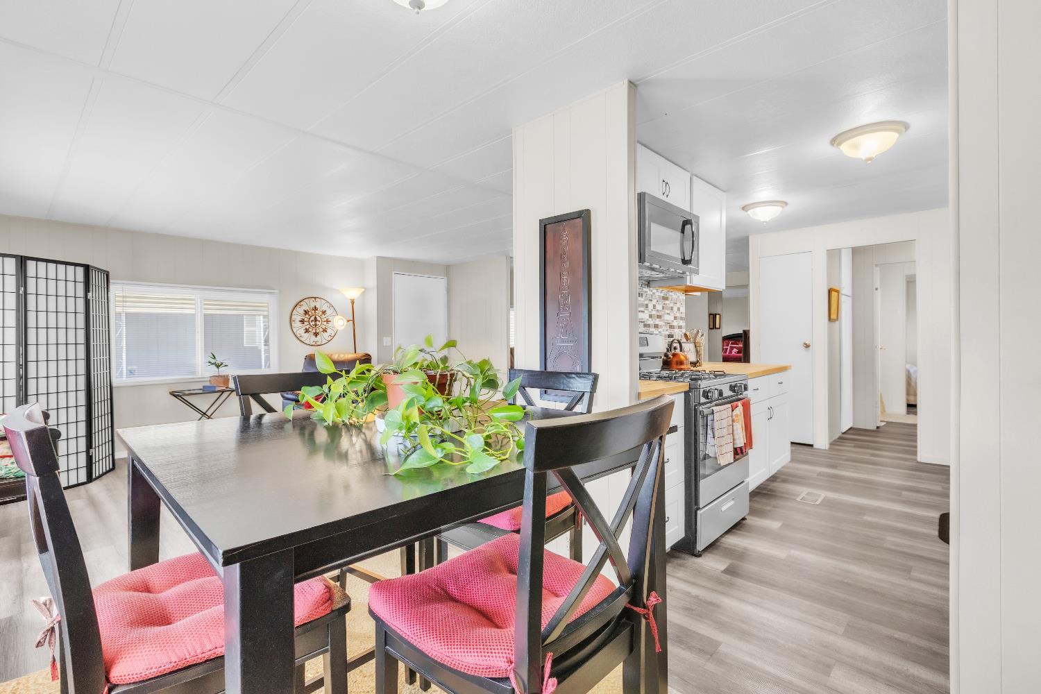 3901 Lake Road, Unit 76 West Sacramento, CA 95691 - Photo 7 of 29 a living room with furniture a dining table and chairs