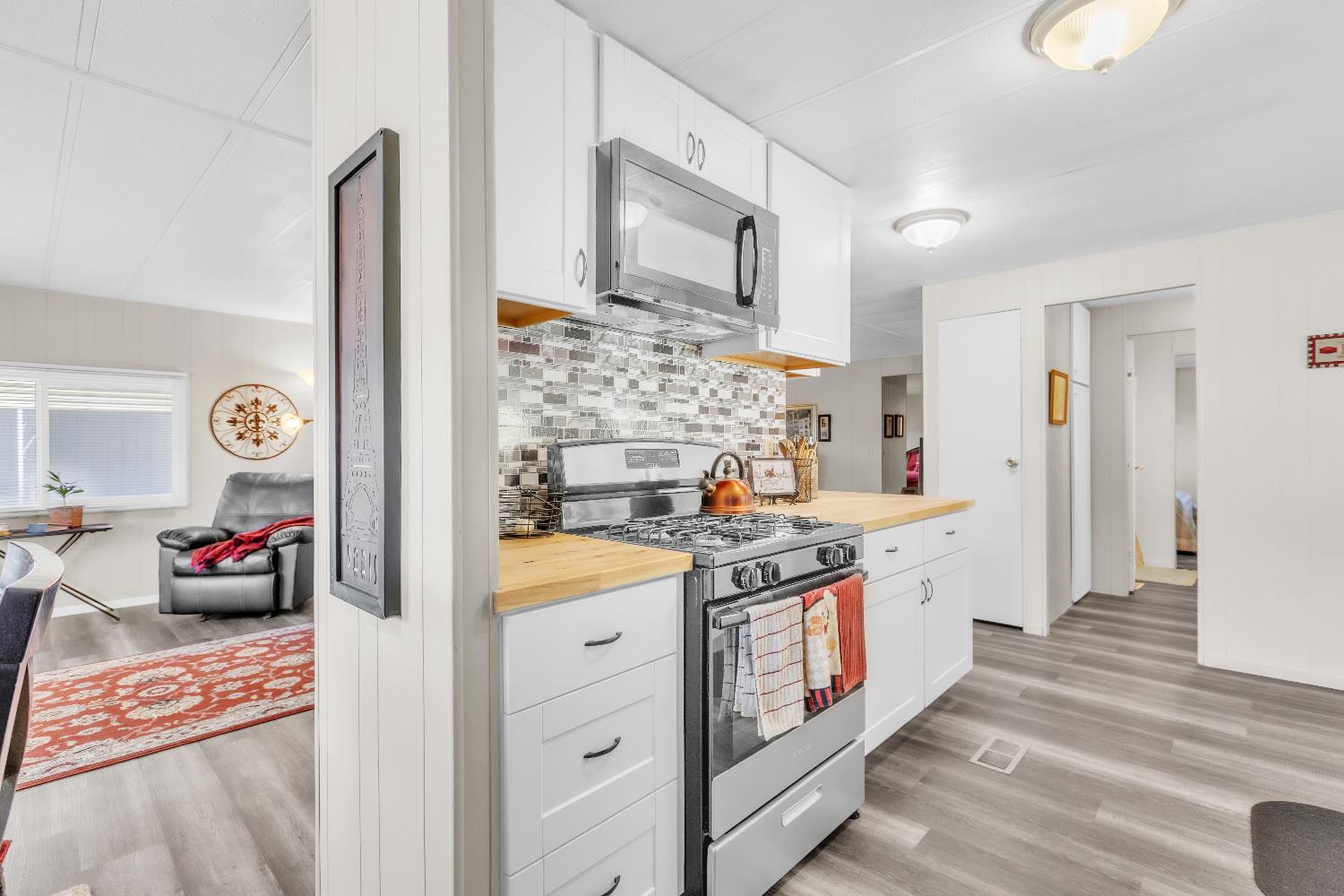 3901 Lake Road, Unit 76 West Sacramento, CA 95691 - Photo 8 of 29 a kitchen with stainless steel appliances granite countertop a stove a sink and a refrigerator