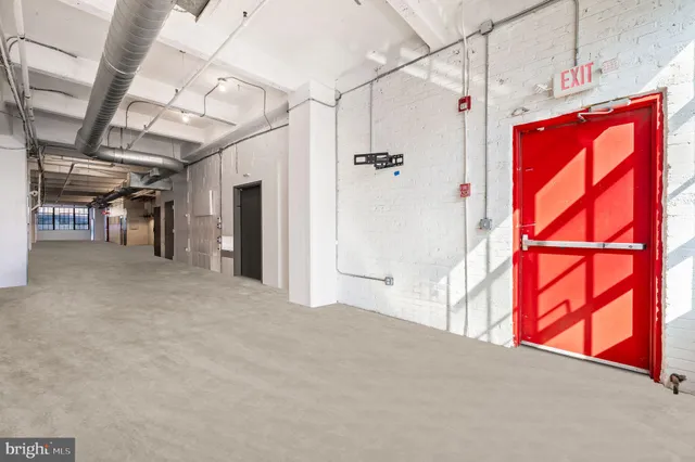 a view of a living room with furniture and a window