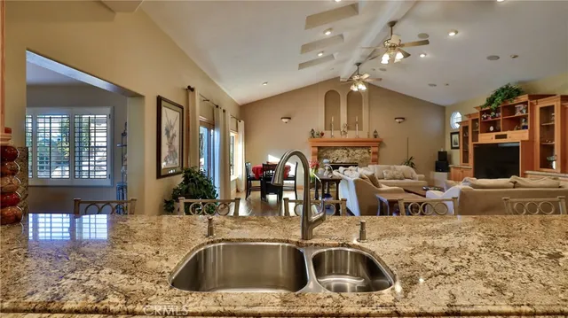 a living room with fireplace furniture and a flat screen tv