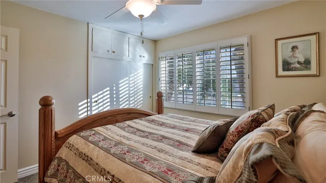 a view of a patio with couches table and chairs and potted plants