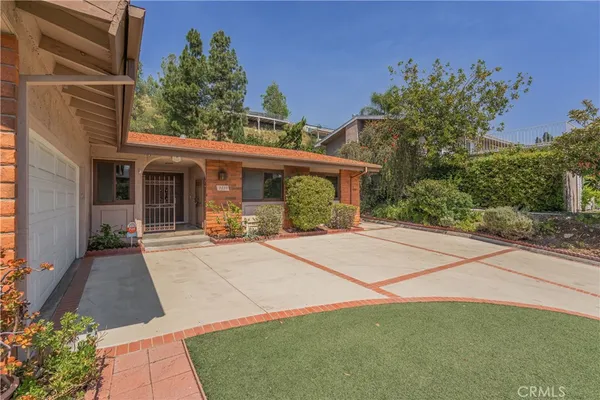 a house with yard in front of it